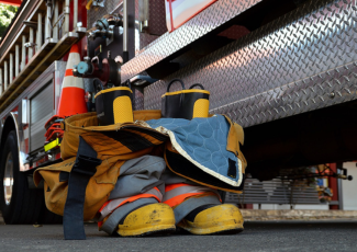 Fire boots beside Fire Truck