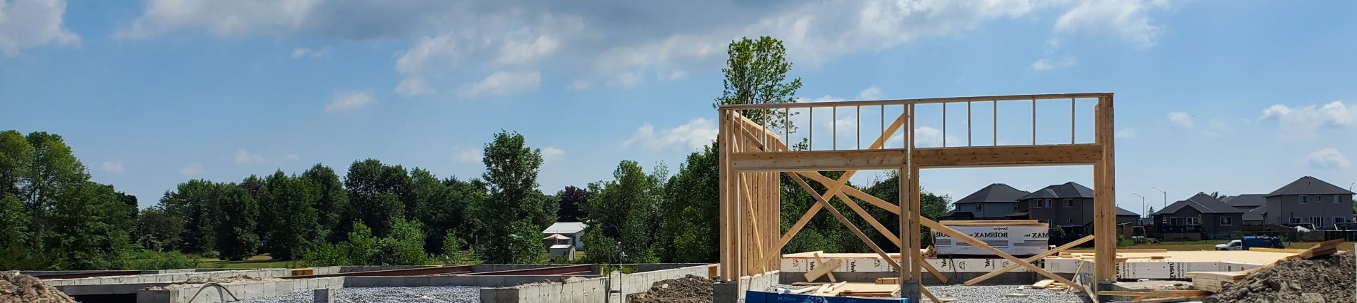 Landscape photo of subdivision and house frame