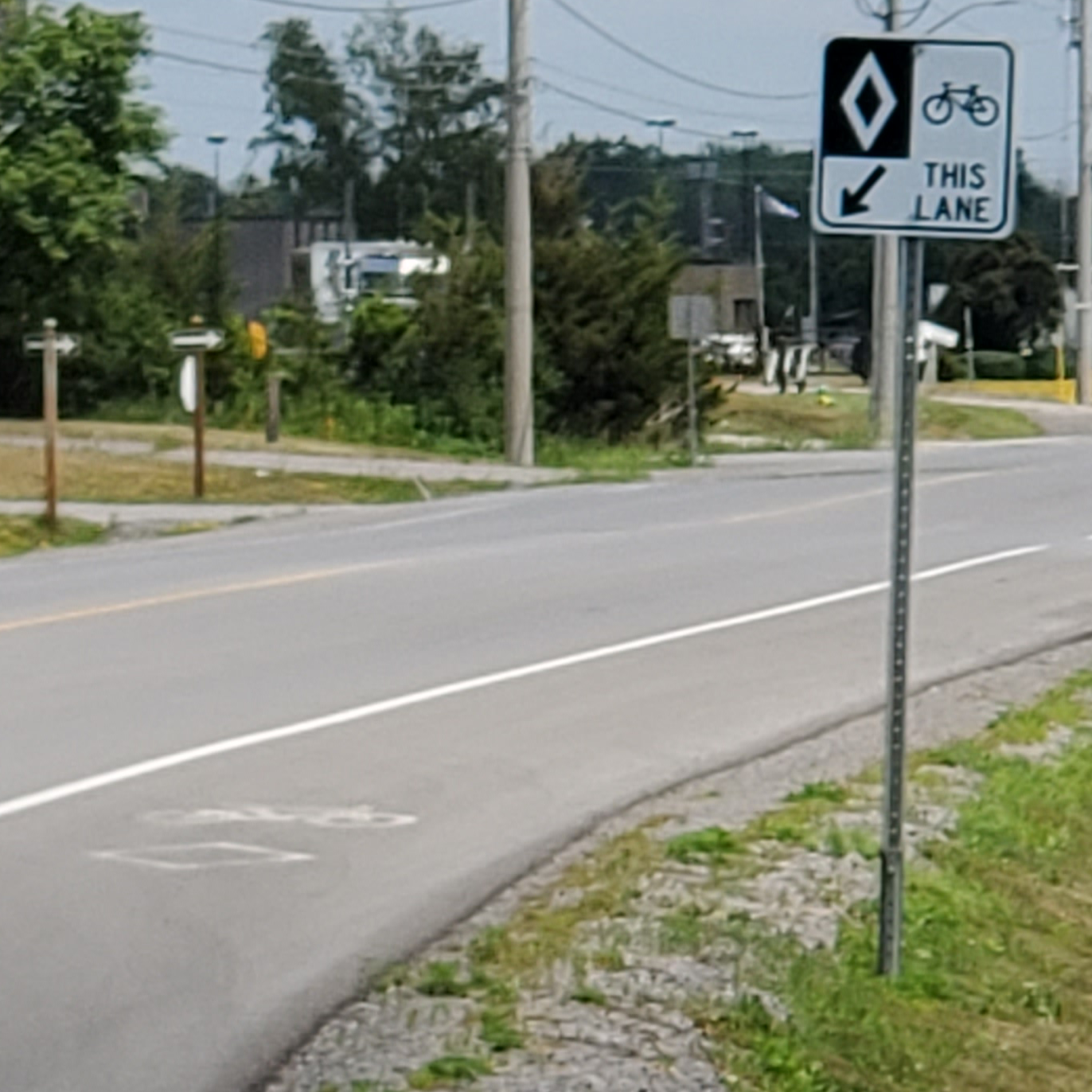 Photo of a bike lane and road sign